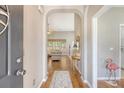 Warm foyer showcasing hardwood floors flowing into the inviting living area at 801 Long Drive Rd, Summerville, SC 29485