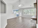 Bright and airy living room with hardwood floors and a sliding glass door at 9016 Greenbriar Dr, Summerville, SC 29485