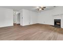 Spacious living room with wood floors, a fireplace, and doorways leading to other rooms at 902 Greenmeadow Dr, Goose Creek, SC 29445