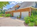 Spacious three-car garage with ample parking and well-maintained landscaping at 109 Waveney Cir, Goose Creek, SC 29445