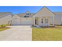 Charming single-Gathering home features a three-car garage and a well-manicured front lawn at 1213 Locals St, Summerville, SC 29485