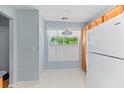 Bright kitchen nook with natural light, featuring a window and white appliances at 122 Stewart Pl, Summerville, SC 29485