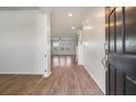 Inviting entryway showcasing wood-look flooring leading into a bright, open living space at 1311 Berry Grove Dr, Summerville, SC 29485