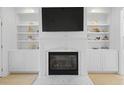 Cozy living room featuring a fireplace with built-in shelves at 132 Fresh Meadow Ln, Mount Pleasant, SC 29466