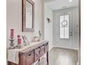 Foyer with a rustic wood console table and decor at 142 Airy Dr, Summerville, SC 29486
