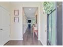 Welcoming hallway with hardwood floors and a view into the living room at 142 Airy Dr, Summerville, SC 29486