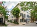 Charming exterior view of an elegant building showcasing historic architecture and verdant trees at 2 Bedons Aly, Charleston, SC 29401