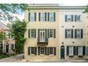 Beautiful exterior view of a classic townhouse, showcasing traditional architecture and a charming street presence at 2 Bedons Aly, Charleston, SC 29401
