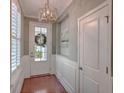 Inviting foyer with hardwood floors, decorative wainscoting, and a stylish light fixture at 2036 Kings Gate Ln, Mount Pleasant, SC 29466