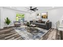 Inviting living room with comfortable seating, contemporary artwork, and a stylish rug at 207 Terry Ave, Summerville, SC 29485