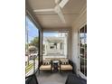 Screened porch offering comfortable seating with cushioned chairs and privacy from the street at 211 Line St, Charleston, SC 29403