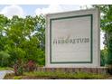 The Arboretum community sign with manicured landscaping and vibrant flowers at 2244 Ashley Crossing Dr # 1125, Charleston, SC 29414