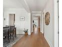 Bright hallway featuring hardwood floors, white trim, and access to multiple rooms at 2313 Bucktail Ct, Mount Pleasant, SC 29466