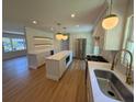 Spacious, updated kitchen with an island, stainless steel appliances, and modern lighting at 2456 Lantern St, Charleston, SC 29414