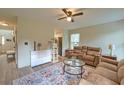 Inviting living room with a comfortable brown sofa, patterned rug, and natural light, creating a warm atmosphere at 2538 Wayne Scott Ct, Charleston, SC 29414