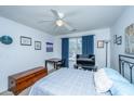 Comfortable bedroom with carpet, ceiling fan, blue accents, and natural light from the window at 2601 Riverridge Ct # A, Moncks Corner, SC 29461