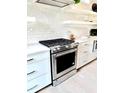 Close-up of the gas range and modern appliances in this spacious and beautifully designed kitchen at 30 Nats Ct, Charleston, SC 29403