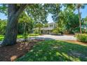 Charming home with a swing and landscaped front yard and gravel driveway at 3002 Waterway Blvd, Isle of Palms, SC 29451