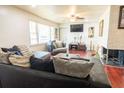 Inviting living room with comfortable seating and a charming brick fireplace feature at 320 Morrison Street, Mount Pleasant, SC 29464