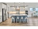 Spacious kitchen features a center island, stainless appliances, and modern light fixtures at 360 Parish Farms Dr, Summerville, SC 29486