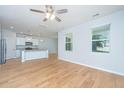 Bright living room with hardwood floors and an open view to the kitchen at 3745 Sawmill Ct, Mount Pleasant, SC 29429