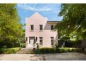 Charming two-story home with a stucco exterior, complemented by lush landscaping and a welcoming entrance at 429 Venning St, Mount Pleasant, SC 29464