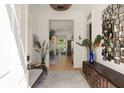Elegant foyer featuring wood floors, a decorative mirror, stylish console table, and views into the home at 429 Venning St, Mount Pleasant, SC 29464