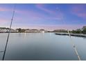 Waterfront view with fishing poles in a beautiful community with fountain in the lake at 4765 Arco Ln, North Charleston, SC 29418