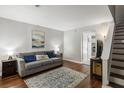 Inviting living room with hardwood floors, comfortable gray sofa, and neutral decor provides a relaxing atmosphere at 507 Stinson Dr # E8, Charleston, SC 29407