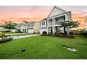 Lovely two-story home with manicured lawn and inviting front porch, set within a peaceful neighborhood at 529 Dunswell Dr, Summerville, SC 29486