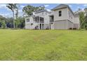 Expansive backyard featuring lush green grass, perfect for outdoor activities and relaxation at 619 Du Bois Dr, Johns Island, SC 29455
