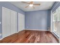 Bedroom boasts hardwood floors, natural light, and double closets for ample storage at 700 Daniel Ellis Dr # 3108, Charleston, SC 29412
