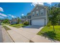Attractive two-story home with a well-kept lawn, a two-car garage, and a welcoming neighborhood vibe at 704 Kilarney Rd, Summerville, SC 29483