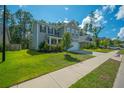 Charming two-story home featuring a lush green lawn and appealing landscaping, perfect for suburban living at 704 Kilarney Rd, Summerville, SC 29483