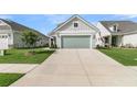 Charming home with a light green garage door and extended driveway at 753 Blue Iris Way, Summerville, SC 29486