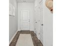Bright hallway featuring neutral paint and a decorative rug at 8712 Silver Perch Ln, North Charleston, SC 29420