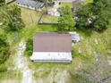 Aerial view of a home, showcasing its roof, surrounding greenery, and neighboring buildings at 93 Knights Ave, Walterboro, SC 29488