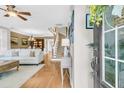 Inviting living room featuring a staircase, hardwood floors, and comfortable seating arrangements at 1100 Griswold St, Mount Pleasant, SC 29466