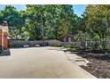 Long driveway with an outdoor swing set and landscaping at 1126 Brigantine Dr, Charleston, SC 29412