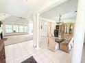 Bright dining room with tile floors, chandelier, and easy access to the living room at 1804 Bass Rd, Moncks Corner, SC 29461