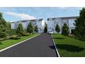 Modern townhome community with gray siding, well-maintained lawns, and a scenic walkway at 2161 W Jimtown Dr # 101, North Charleston, SC 29405