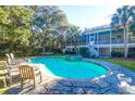Beautiful backyard pool and spa with ample room for lounging in this incredible outdoor space at 2514 Myrtle Ave, Sullivans Island, SC 29482