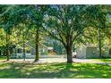 Exterior showing multiple buildings and structures with well-maintained lawns and mature trees, creating a tranquil setting at 286 Mallard Lake Rd, Dorchester, SC 29437
