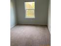 Cozy bedroom with soft carpeting and a bright window offering natural light at 4669 Palm View Cir, North Charleston, SC 29418