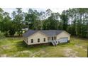 Inviting yellow home features a side-entry garage and lush green surroundings at 480 Longleaf Dr, Walterboro, SC 29488