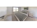 Bright bedroom with a large bed, neutral decor, and a scenic view from the windows at 550 Pender Woods Dr, Summerville, SC 29486