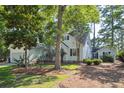 A well-maintained home with mature trees, lush lawn, and a neatly mulched garden at 642 Bridlewood Ln, Mount Pleasant, SC 29464