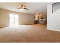 Bright living area with sliding doors and a view of the kitchen at 8285 Little Sydneys Way, North Charleston, SC 29406