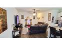 Comfortable living room featuring a leather sofa, a television, and decorative art at 9430 Sweep Dr, Summerville, SC 29485