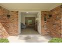 Inviting entryway with brick walls and stone floors leading to a bright, open interior at 96 King Charles Cir, Summerville, SC 29485